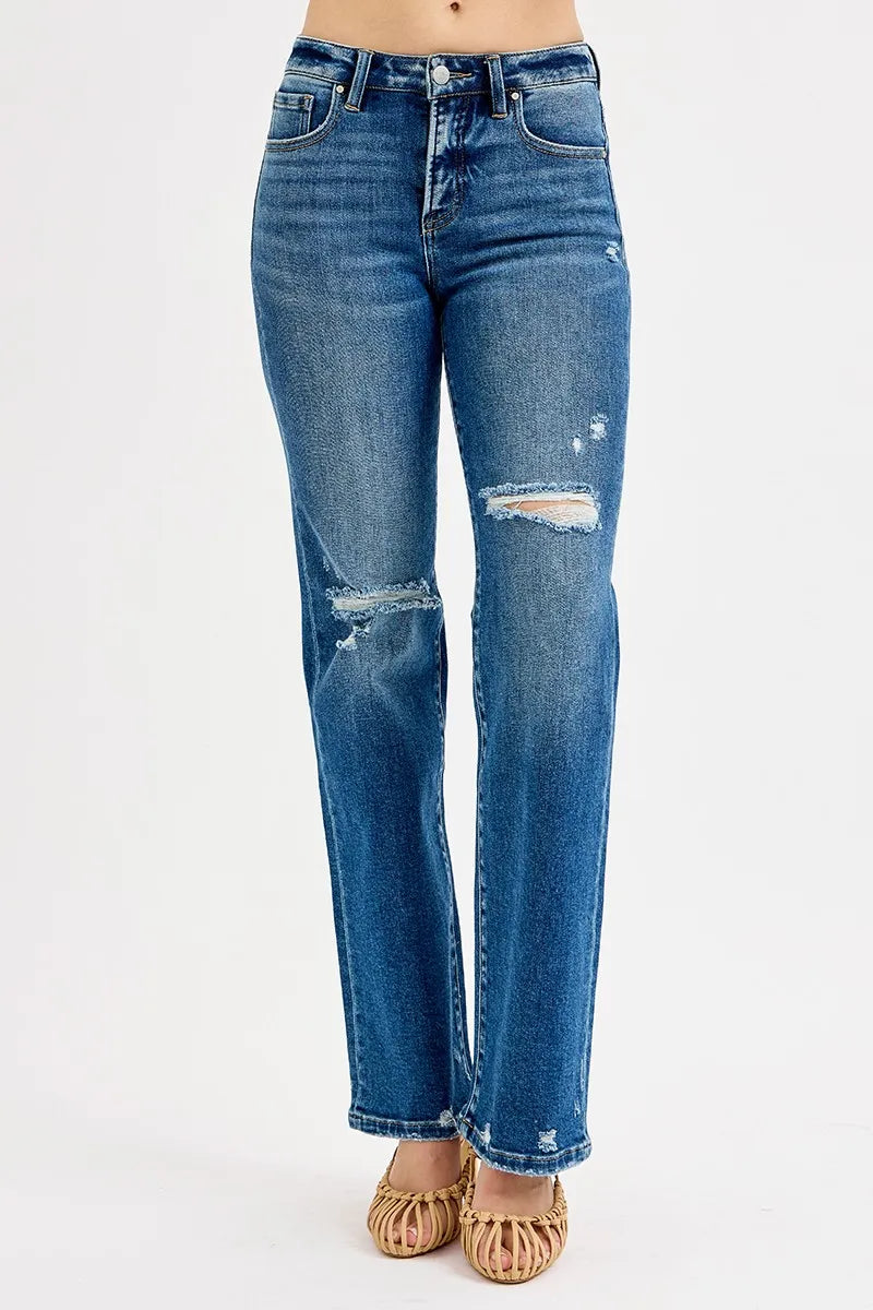 Dark high-rise straight jeans with distressed patches at knees and ankle hem