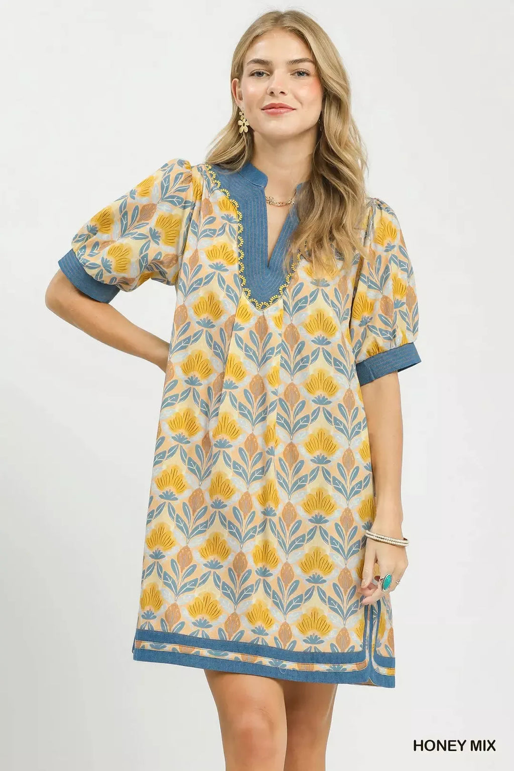 Honey mix mini dress with tile-style floral print and blue V-neck