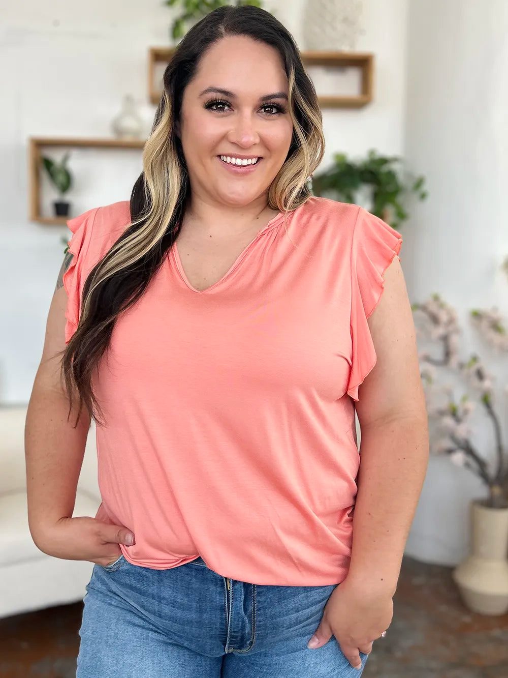 Blush pink notched V-neck T-shirt with full ruffled cap sleeves