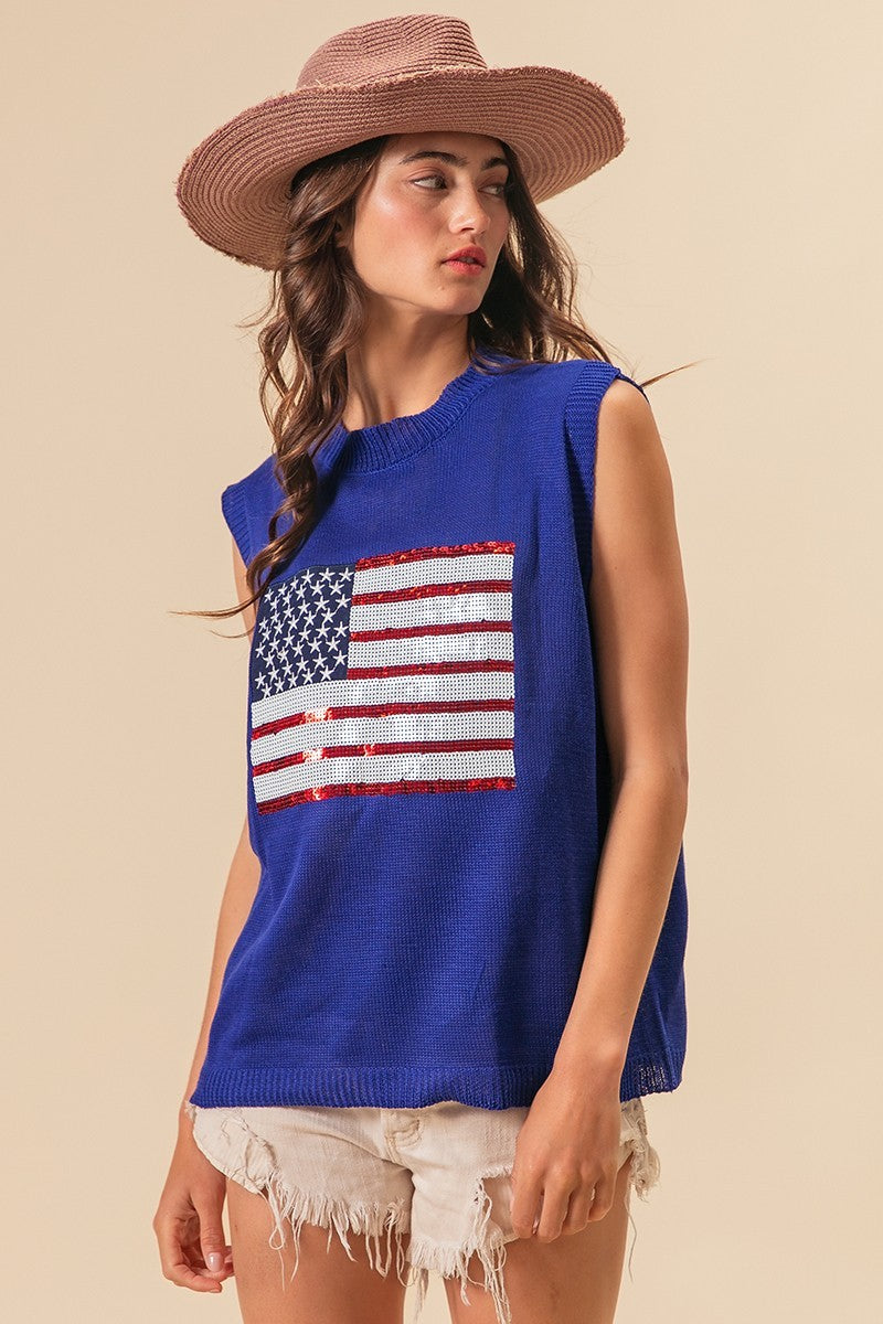 Royal blue knit vest with American flag sequin patch and relaxed side profile