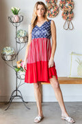 Sleeveless tank dress with blue star bodice and red striped skirt, V-neck
