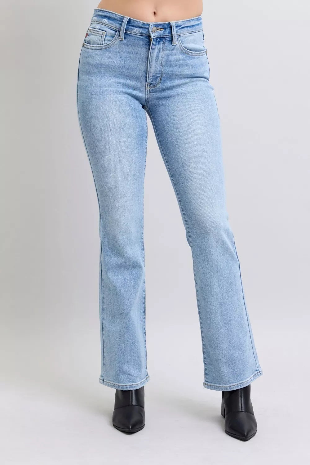 Light wash mid-rise jeans with classic front pockets and button closure