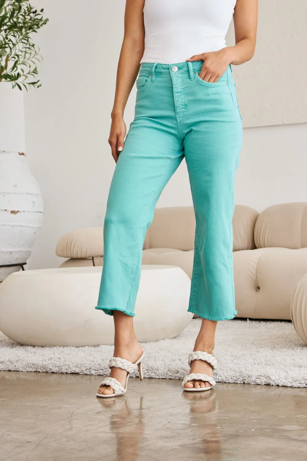 Island Green high-rise flare jeans with raw hem edge and five-pocket design