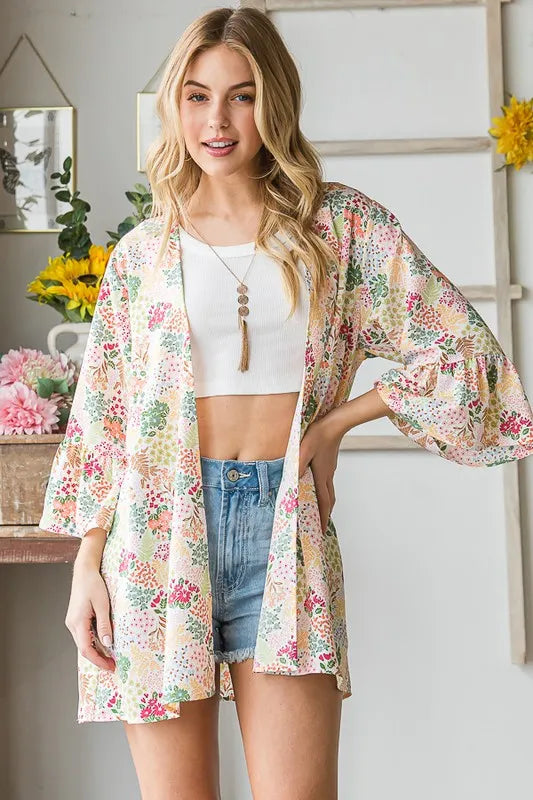 Ivory multi floral open cardigan over white top; draped front, 3/4 sleeves