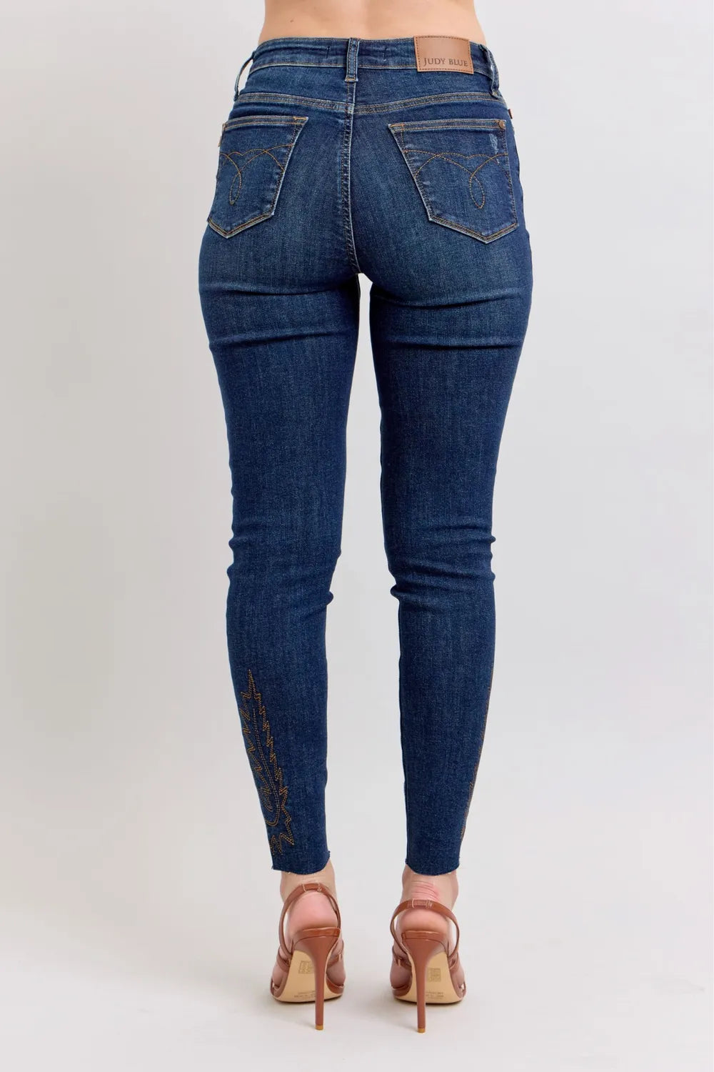 Trendsi Dark blue high-rise skinny jeans with embroidered ankle panels