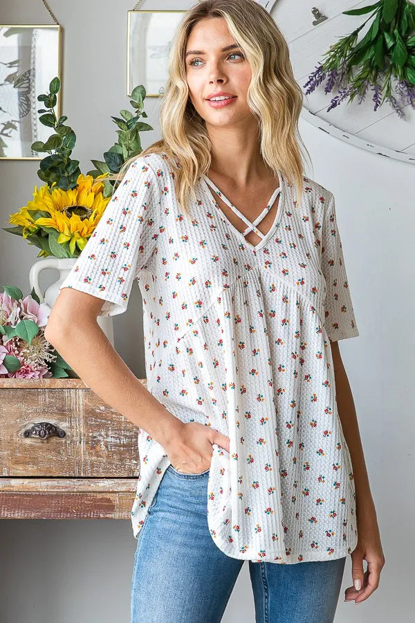 Heimish babydoll top with ditsy floral print, short sleeves, gathered bust and hem