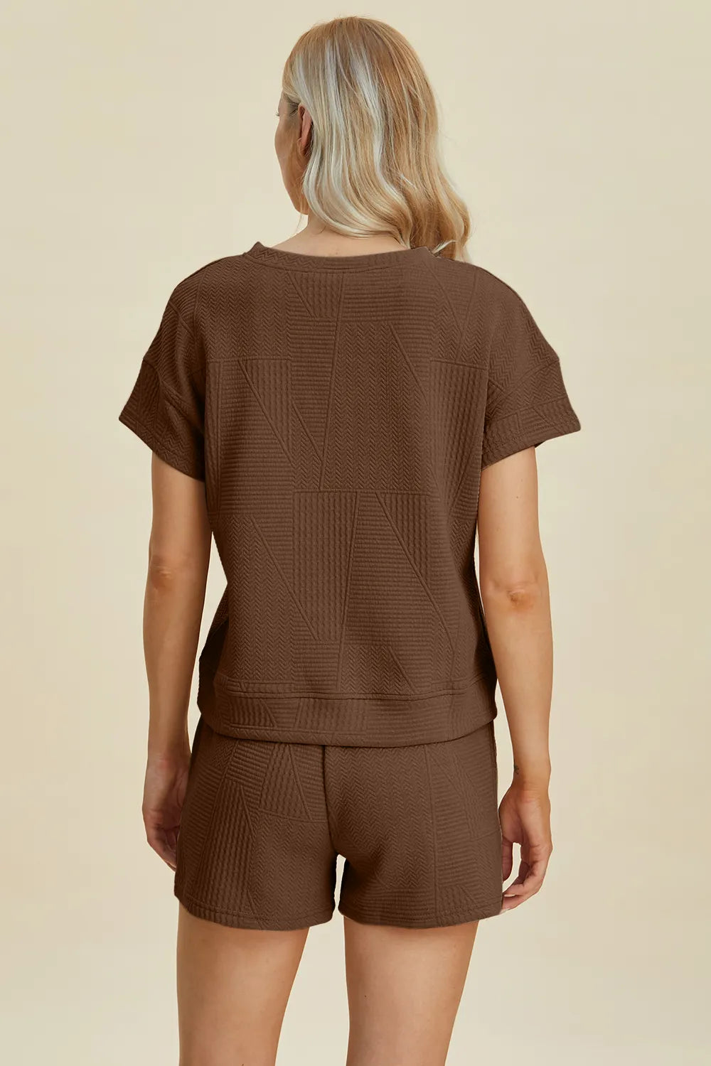 Back view: brown textured short-sleeve top and drawstring shorts set.