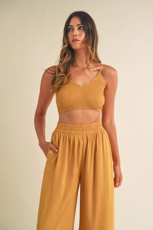 Gold mustard smocked bralette crop top and wide-leg pants, gathered waist detail
