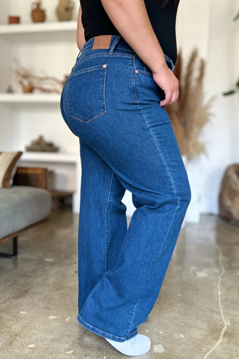 Medium blue high rise straight jeans with front slant pockets and belt loops