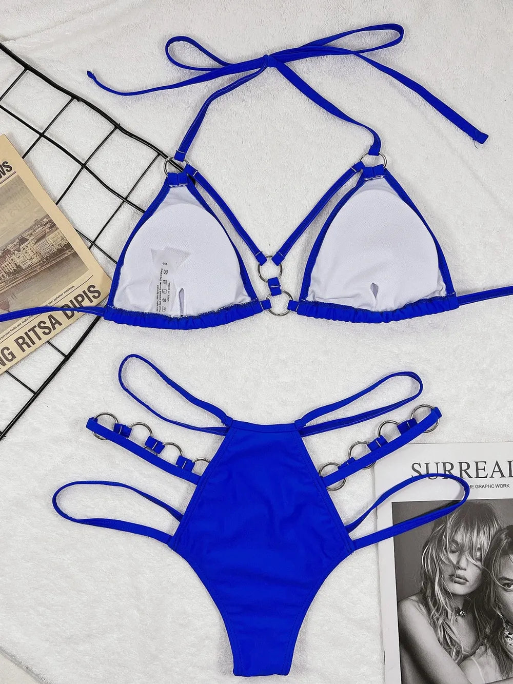 Blue cutout halter triangle bikini set with bow ties, strappy underband and high-leg bottoms