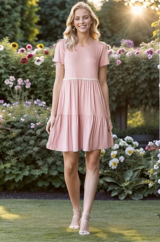 Dusty rose mini tiered dress with pompom lace waist trim and short sleeves