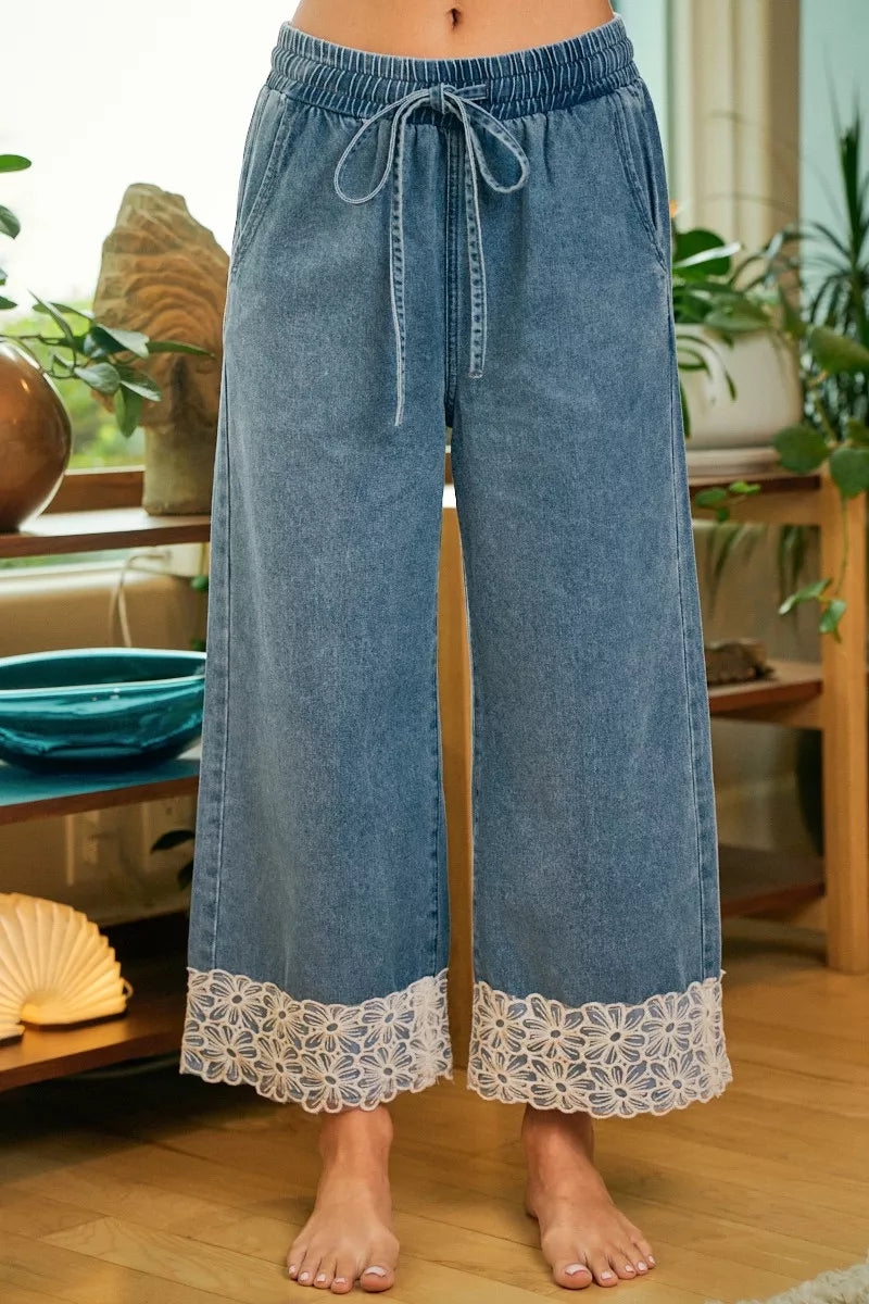 Washed denim pants with elastic waist and drawstring, wide legs, flower lace hem trim