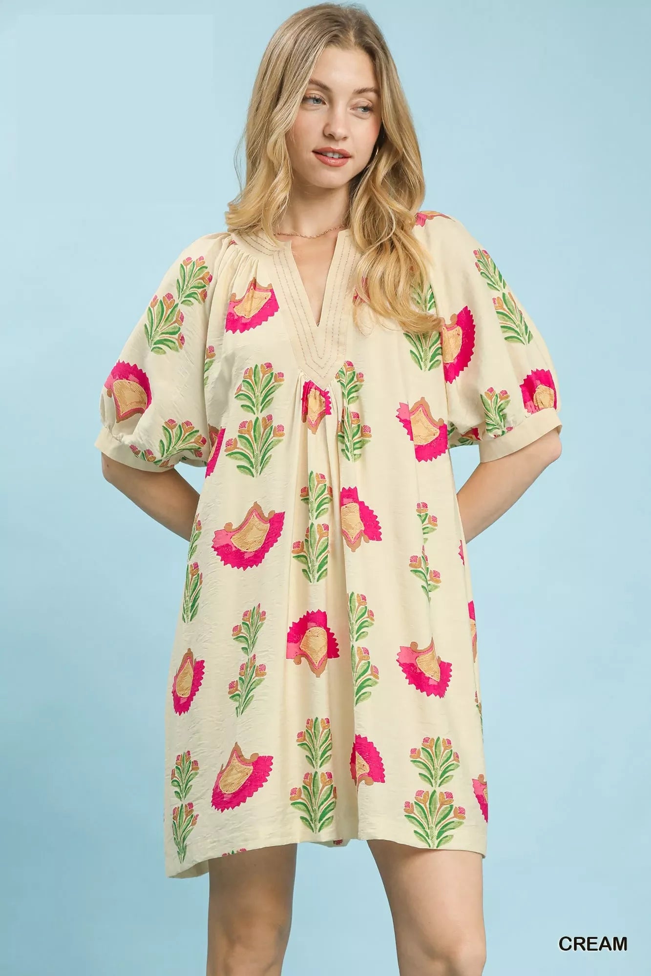 Cream mini dress with abstract bird and leaf print, V-neck
