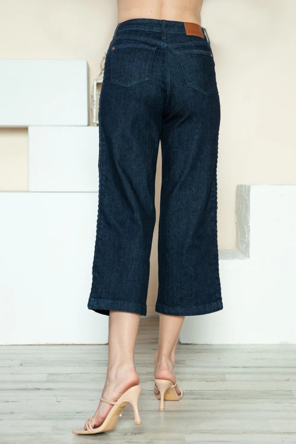Dark wide-leg crop jeans with back yoke, pockets, and straight cropped hem