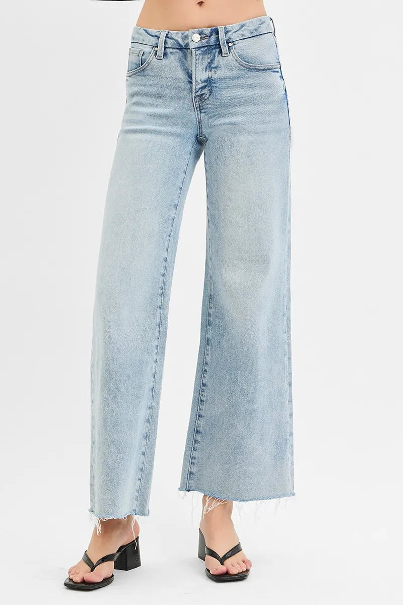 Light-wash low-rise wide-leg jeans, button fly, side seams, raw hem
