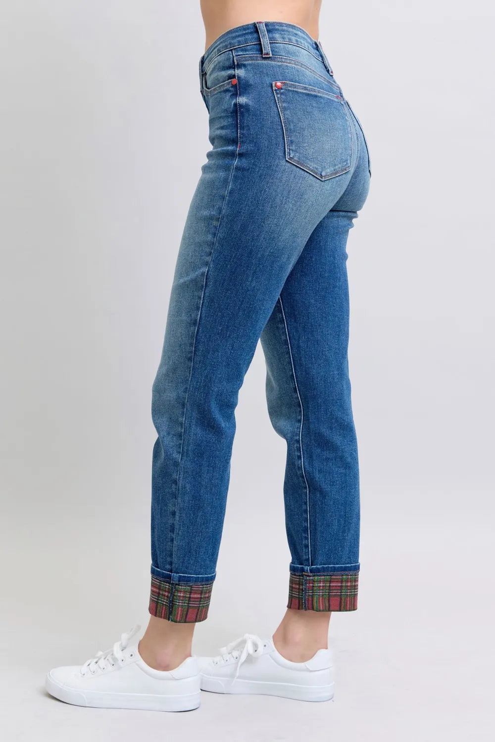 Medium wash straight-leg jeans with plaid cuffs and rear pocket