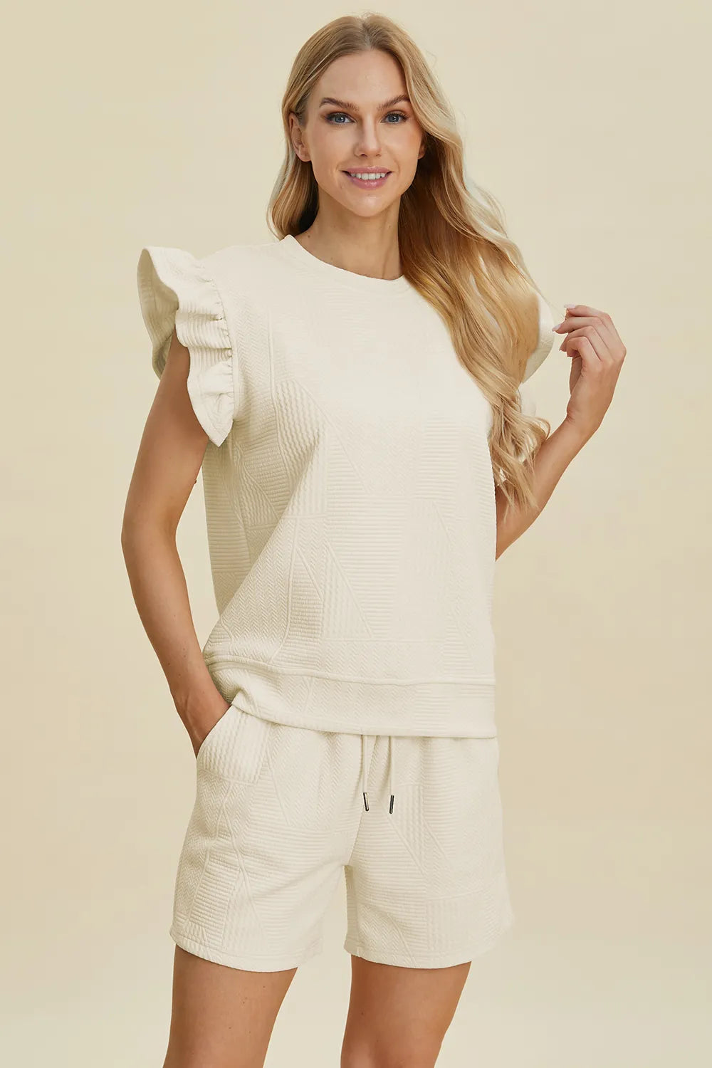 Cream textured ruffle sleeve top and shorts set, side view