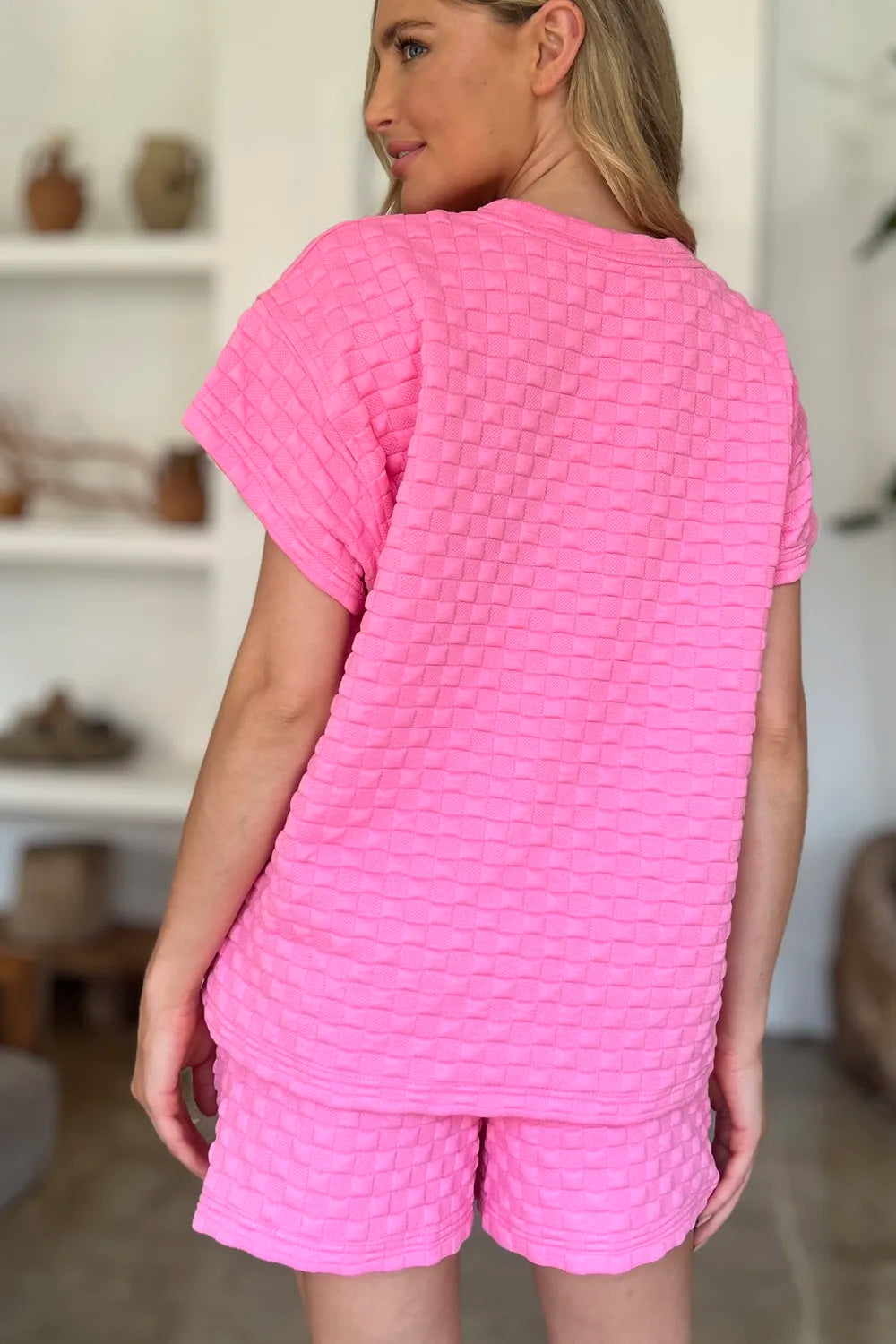 Pink textured matching T-shirt and shorts set, back view with crew neck and elastic hem