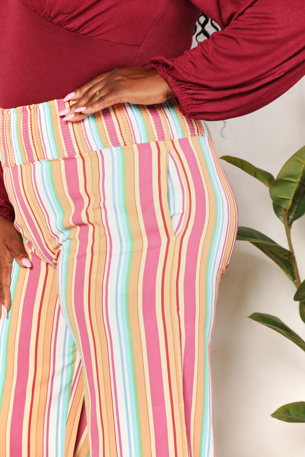 Multicolor vertical stripe pants, smocked elastic waist, side pockets and tapered fit
