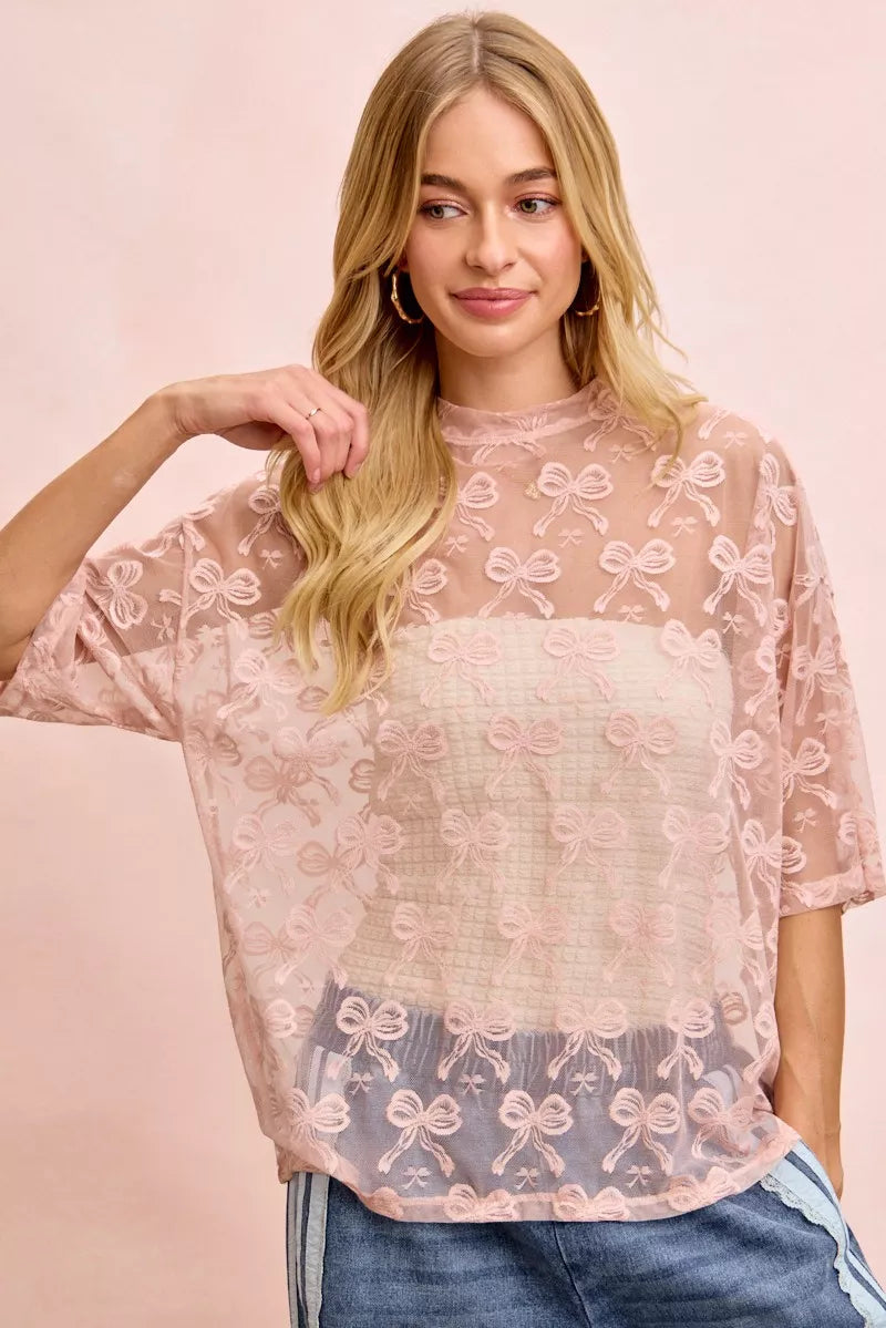 Dusty rose mesh top with embroidered bow pattern, relaxed boxy fit, short sleeves