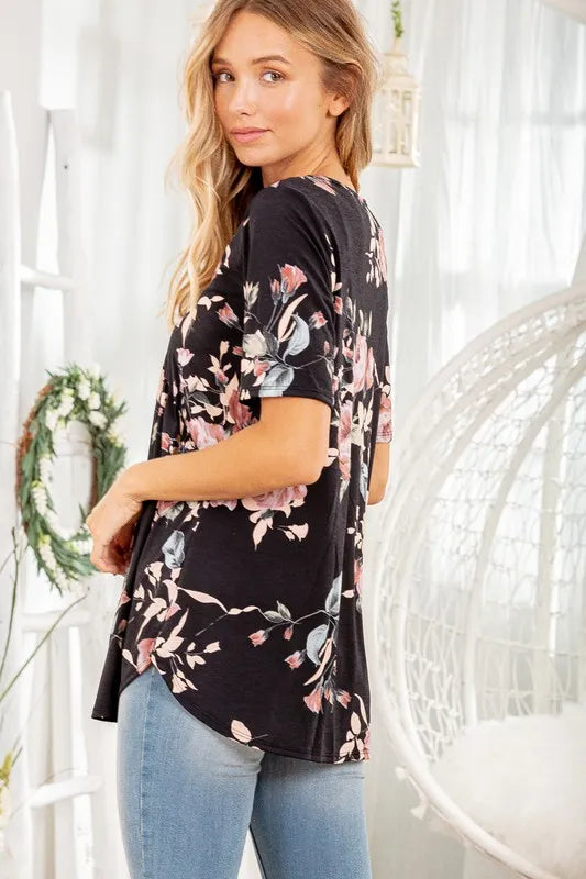 Black floral babydoll top side view with short sleeves