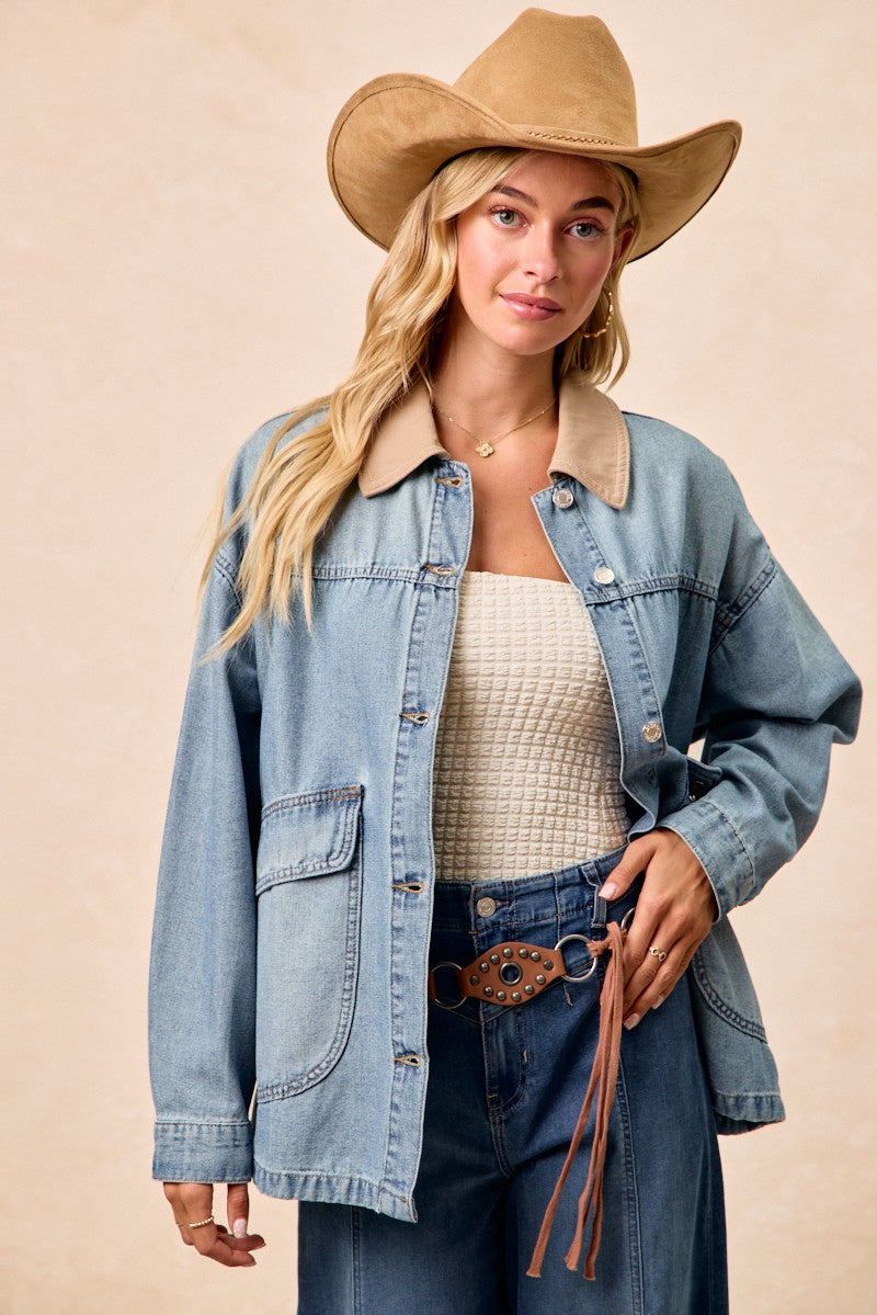 Contrast-collar washed denim jacket with chest buttons and flap pocket details.