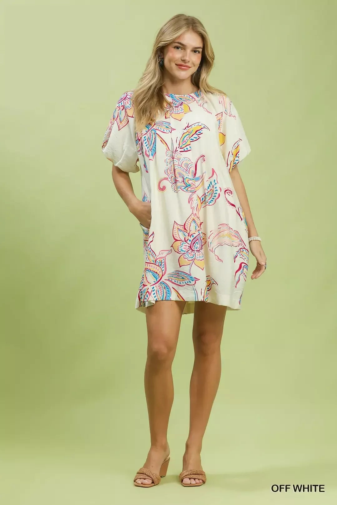 Off-white boho floral mini dress with short sleeves and flared hem