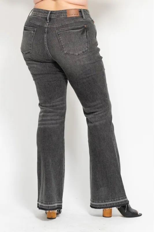 Washed gray mid-rise flared jeans, rear view with two back pockets and release hem