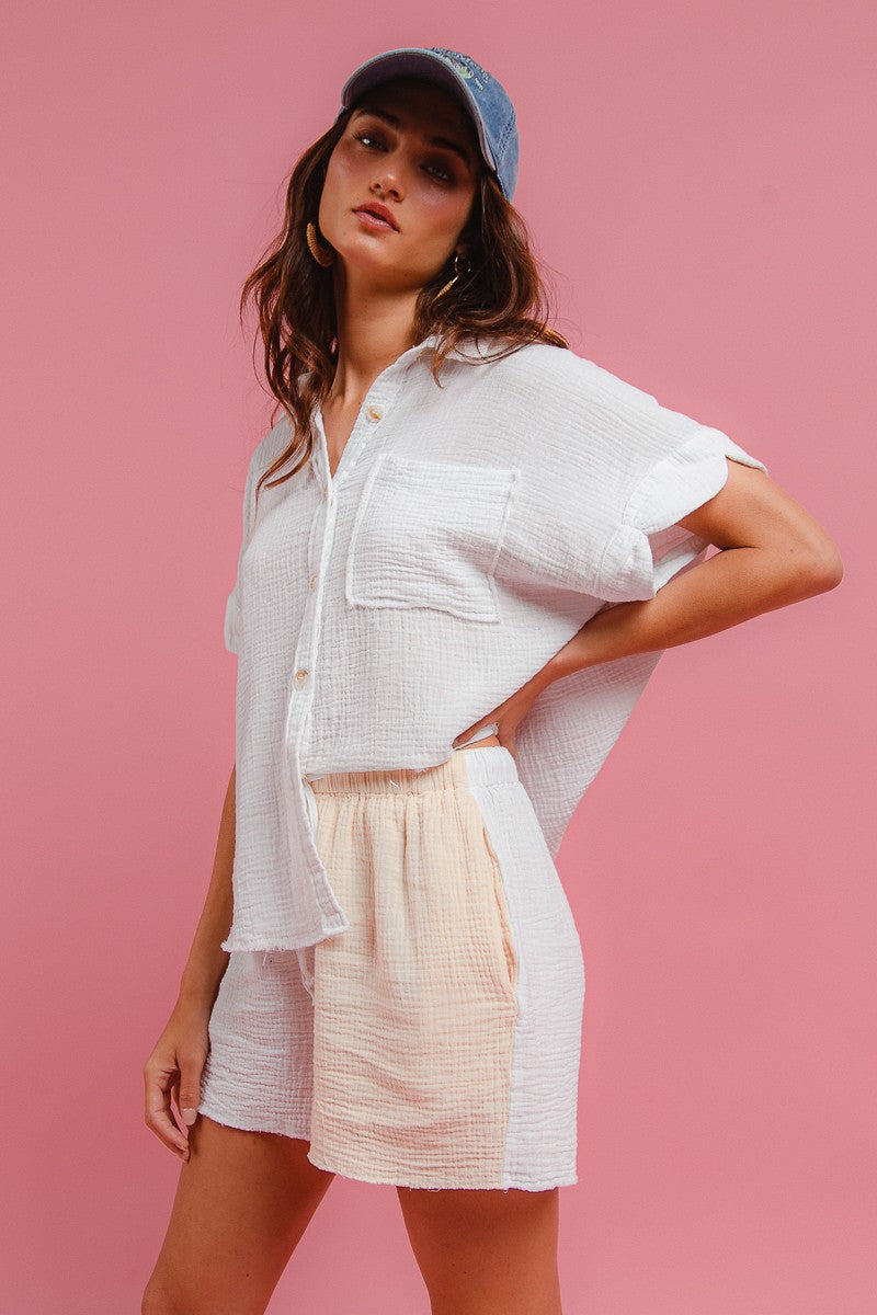 Off-white wrinkled gauze short-sleeve shirt with chest pocket and matching drawstring shorts