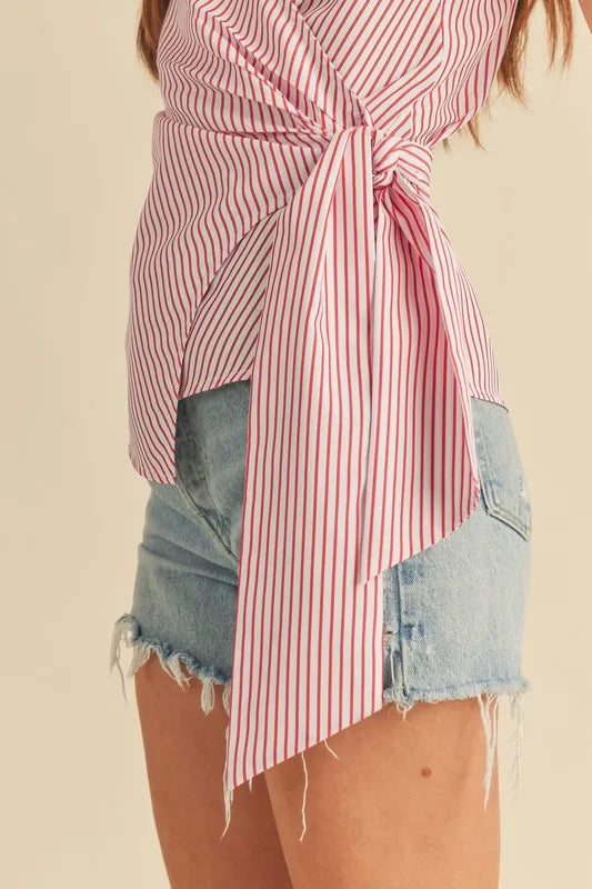 Close-up of side-tie knot on striped surplice cami in white/red pinstripes