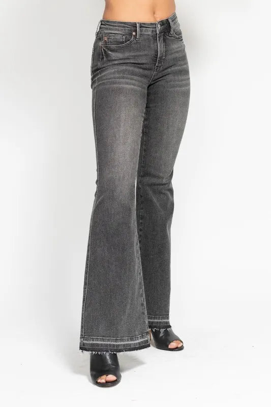 Washed gray mid-rise flare jeans with frayed release hem and dark stitching, plus size