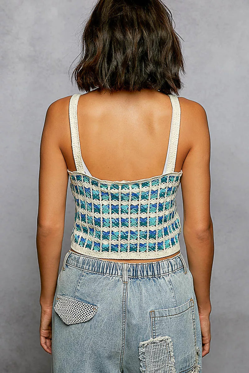 Back of blue multi cropped crochet cami with crisscross crochet detail and white straps