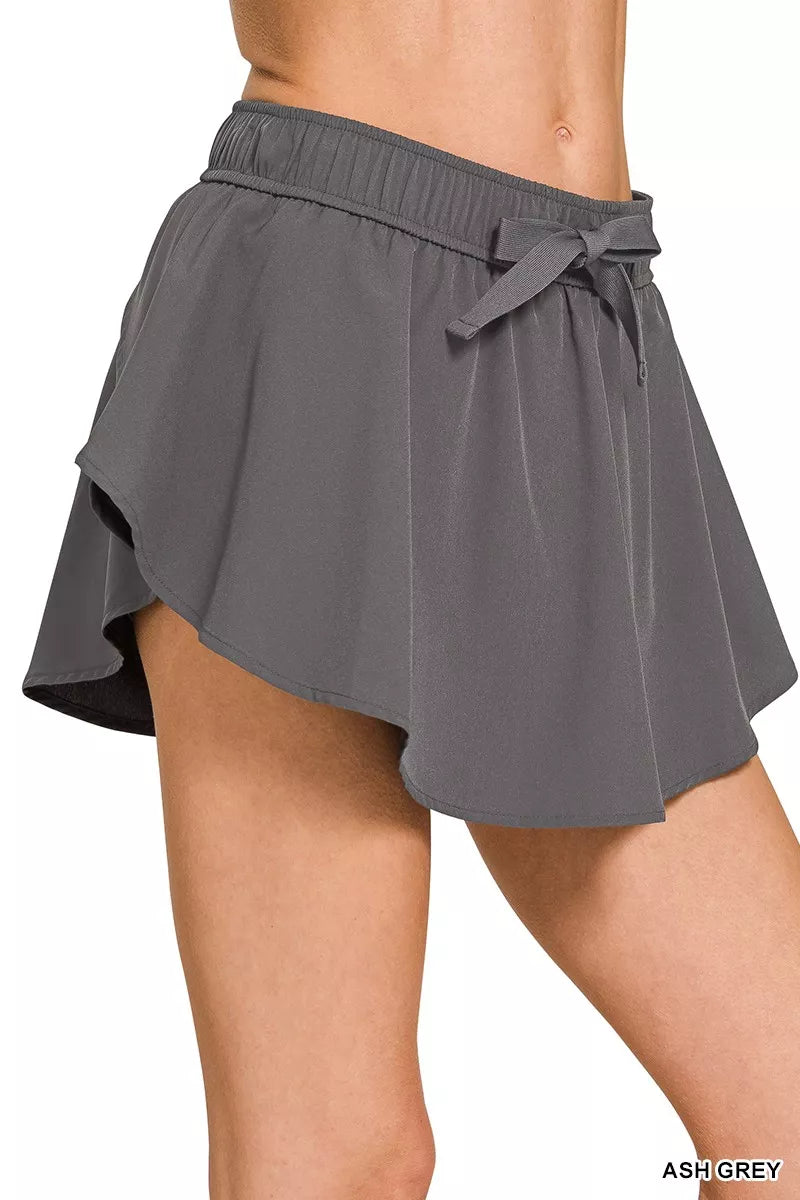 Ash grey active skort with layered A-line skirt and drawstring bow