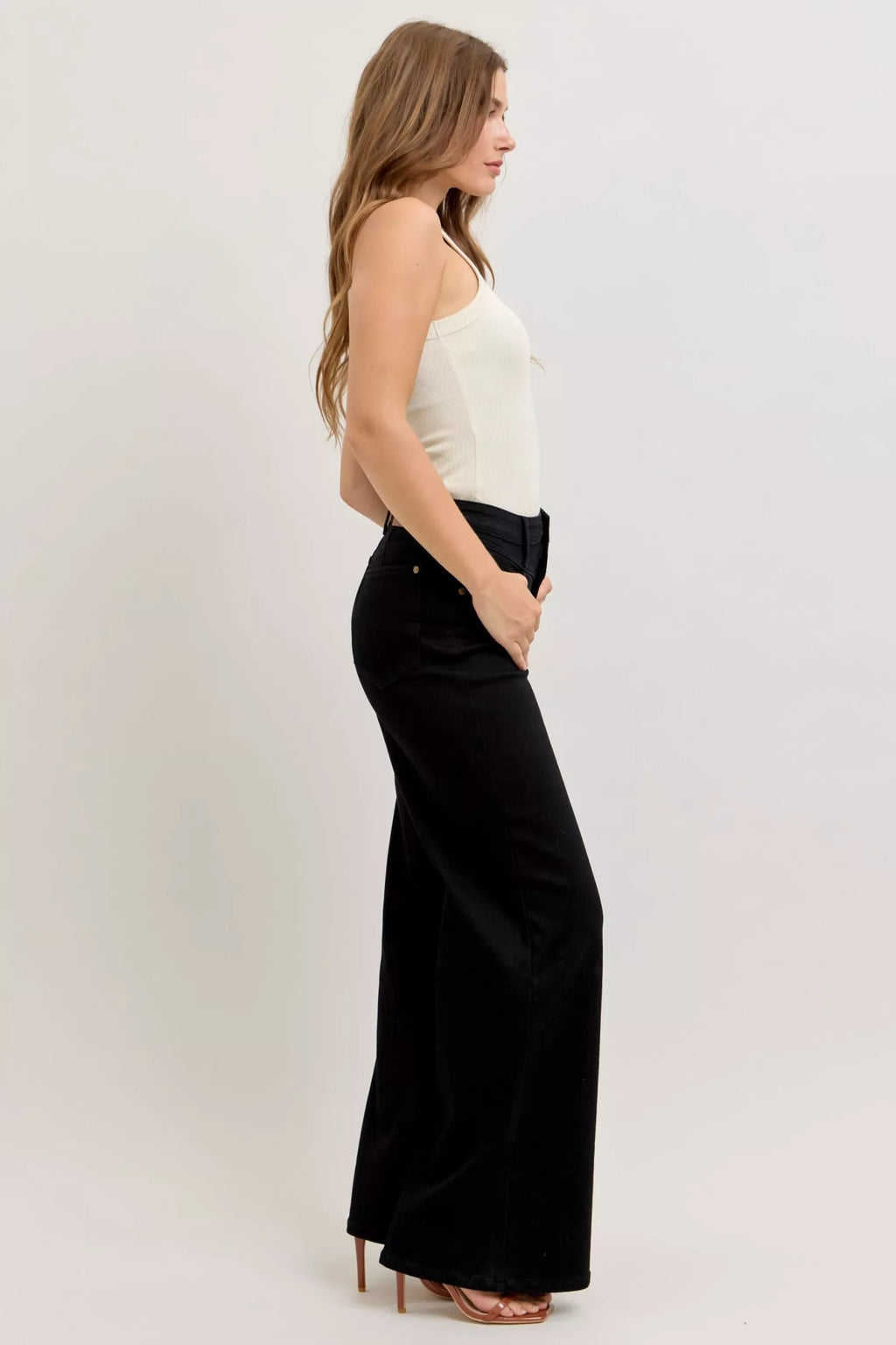 Back/side view of black high-waisted wide-leg jeans with ankle-length hem