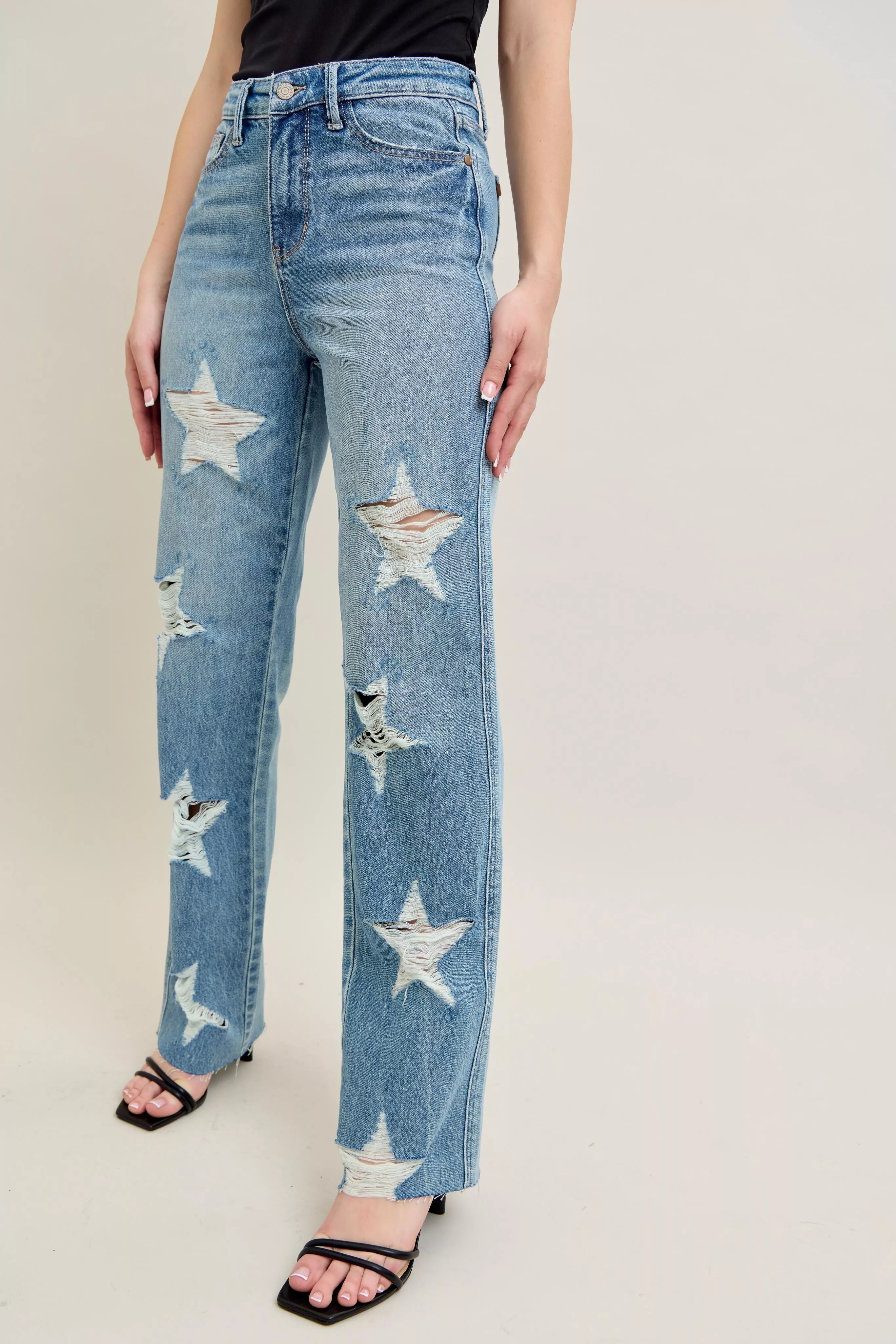 Straight-leg light denim jeans with star rips on thigh and knee