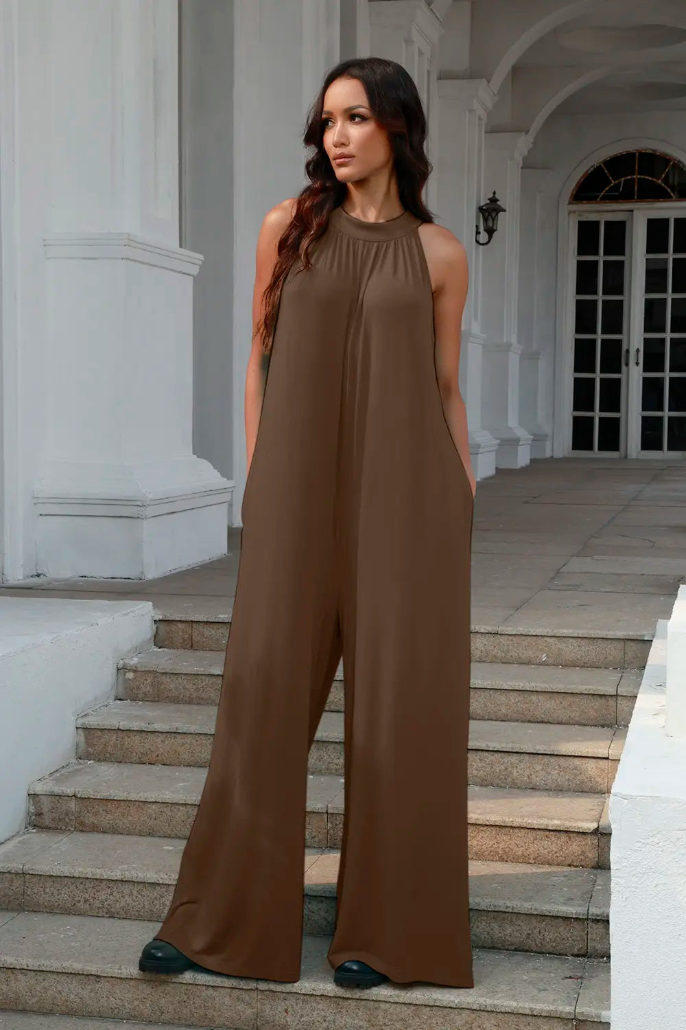 Sleeveless tie-back jumpsuit, brown halter neckline, relaxed wide legs