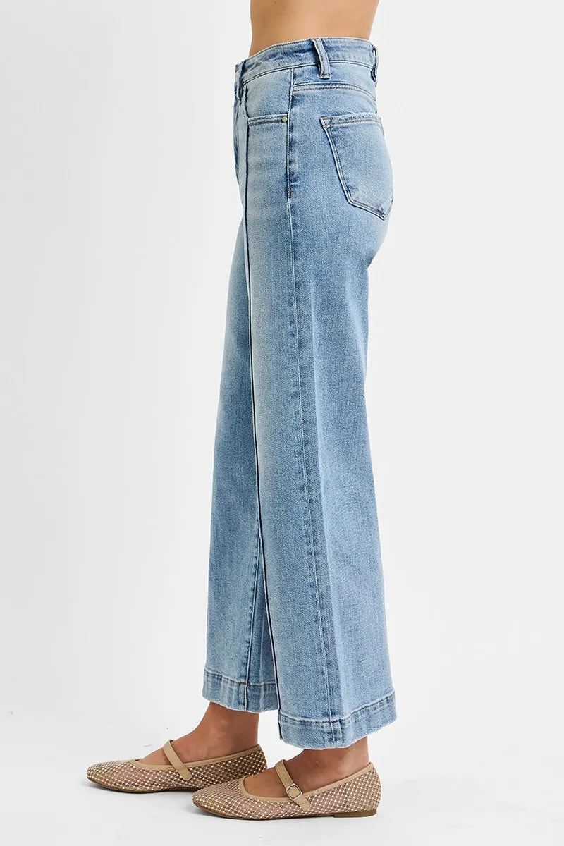 Light-wash crop wide-leg jeans side view, back pocket detail and belt loops