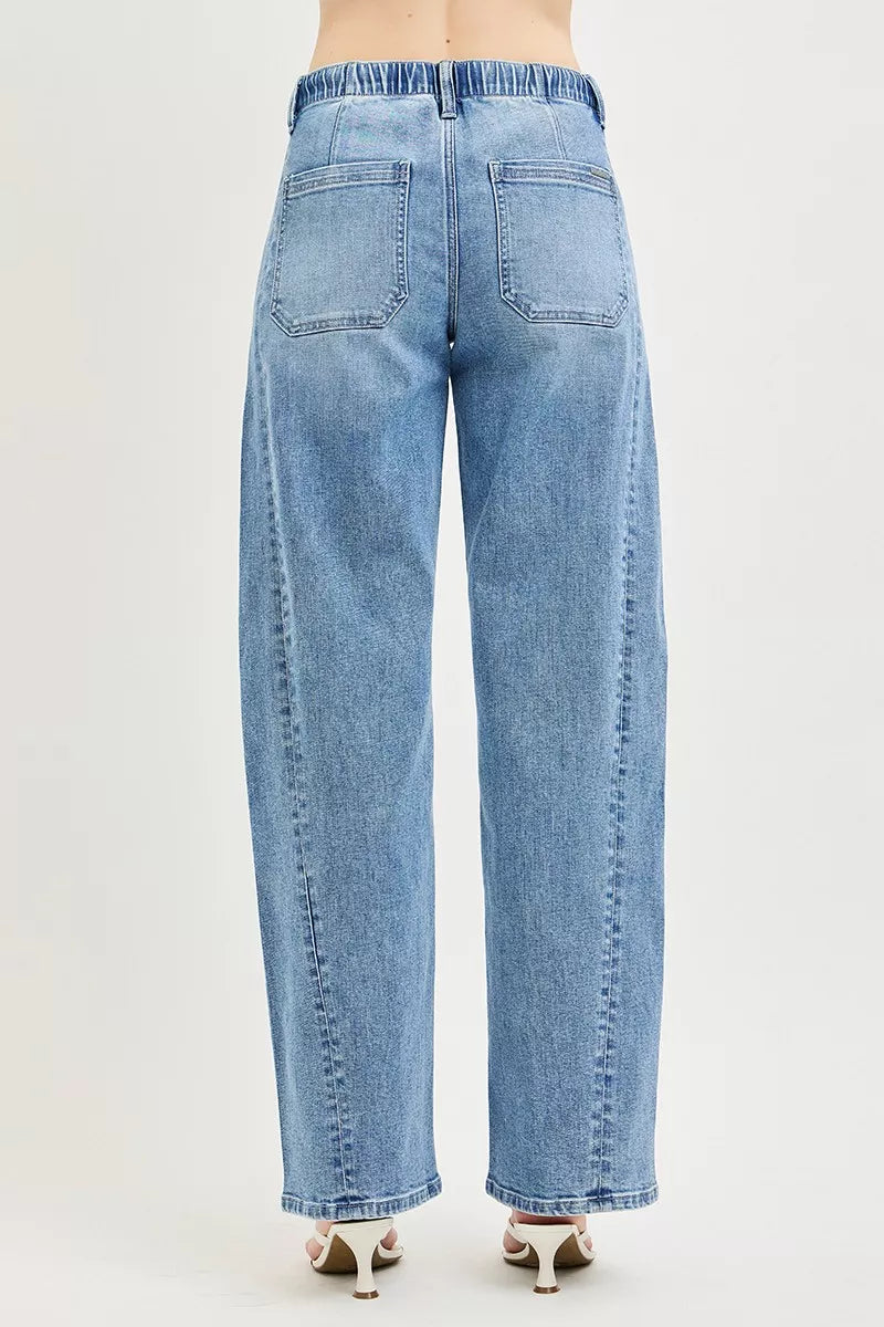 Light wash relaxed jeans back view with elastic waist and two patch pockets