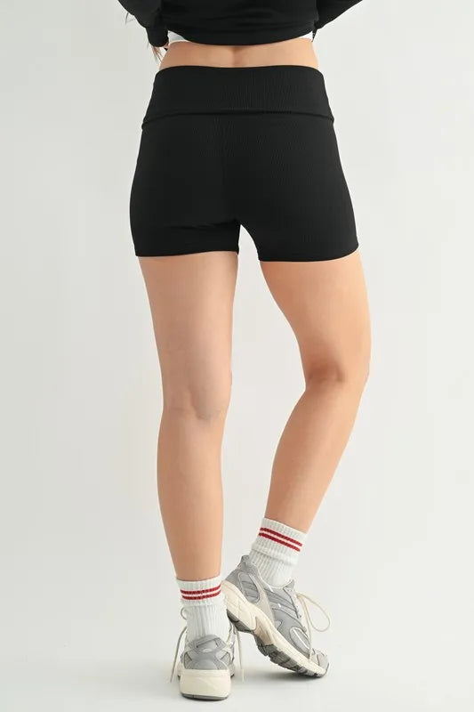 Back view of black ribbed foldover waist shorts with smooth seams