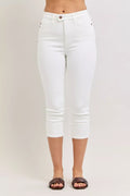 White high-waist capri jeans with extended waistband and spade front pockets