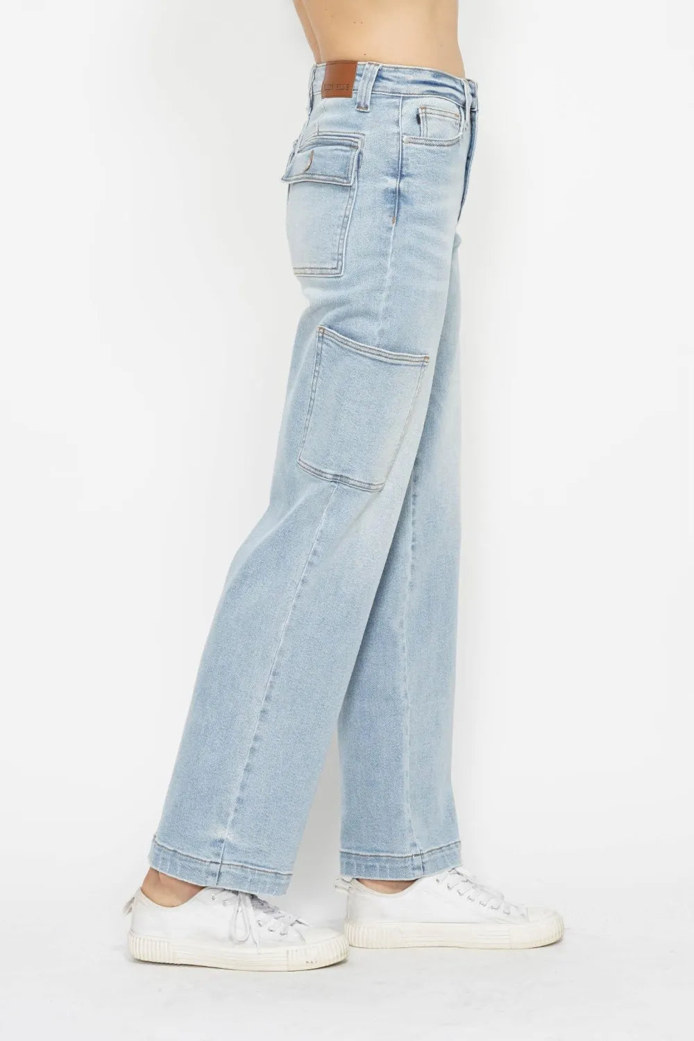 Light blue straight cargo jeans, side profile with cargo pockets and hem