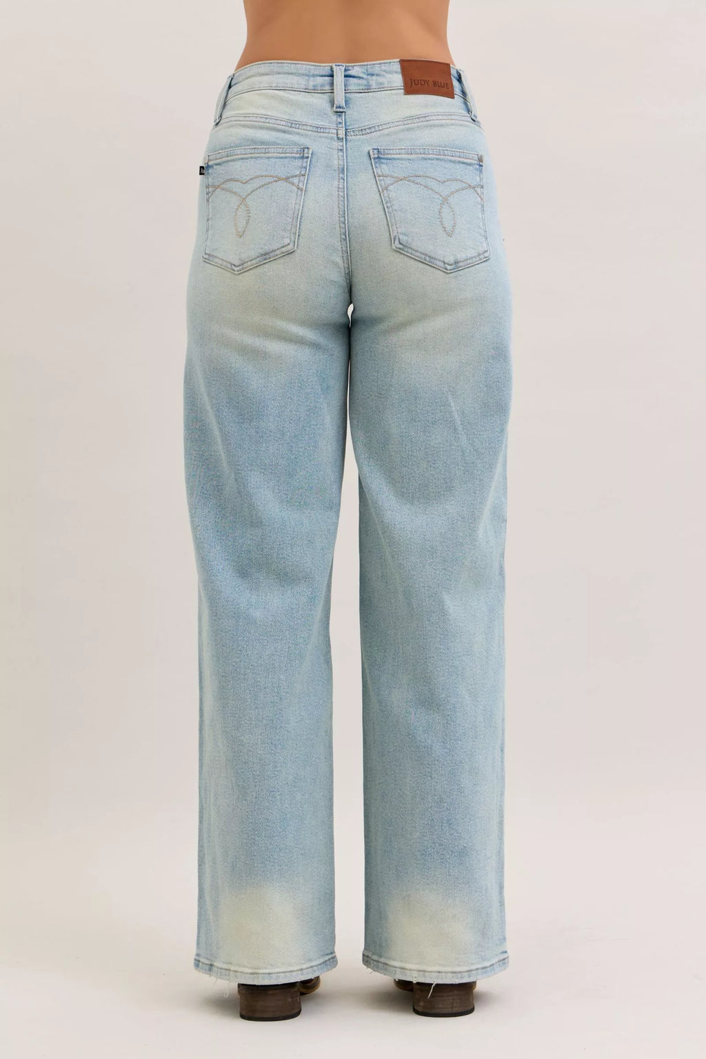 Light blue high-waist straight jeans, back view with yoke seam and visible back pocket details