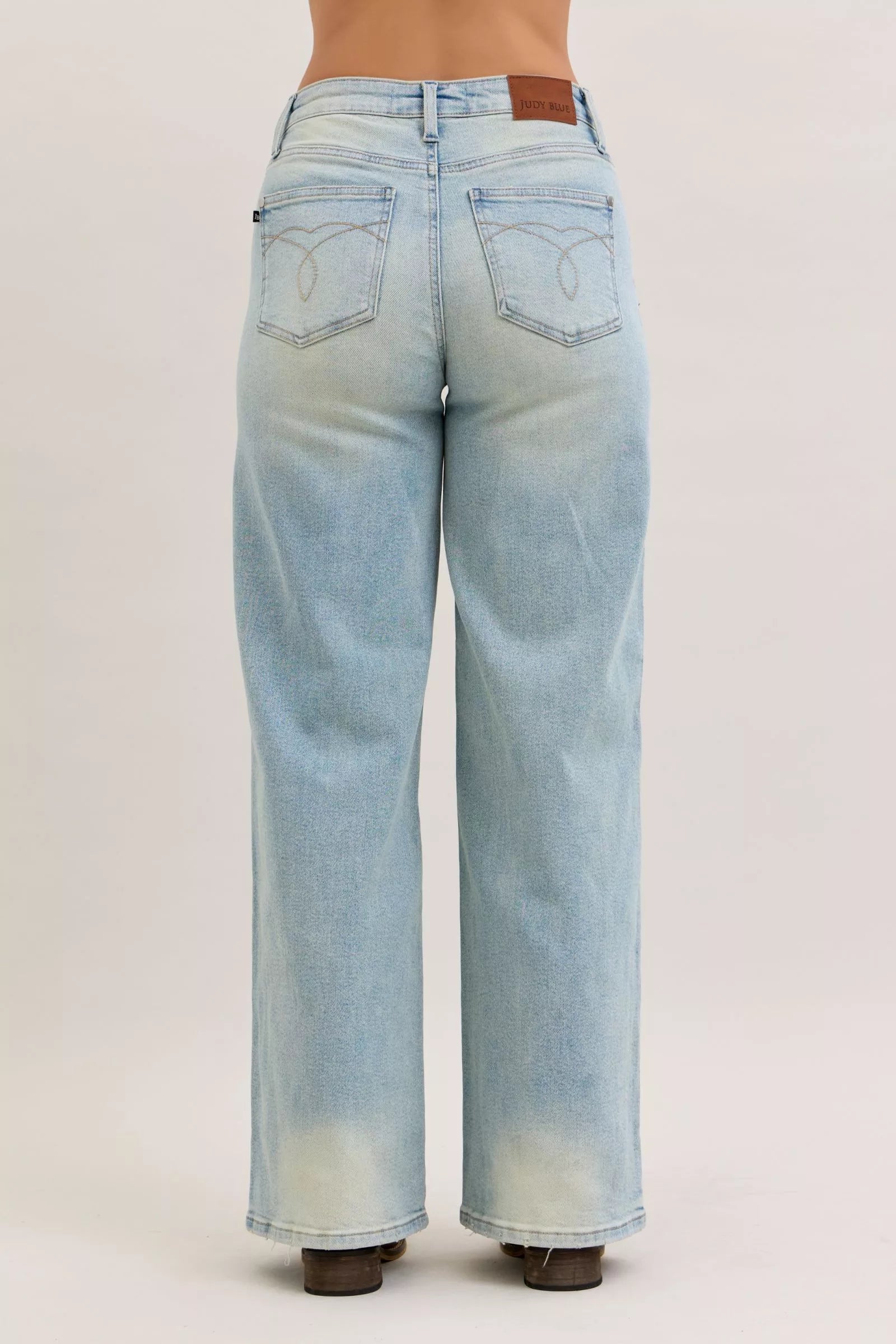 Light blue high-waist straight jeans, back view with yoke seam and visible back pocket details