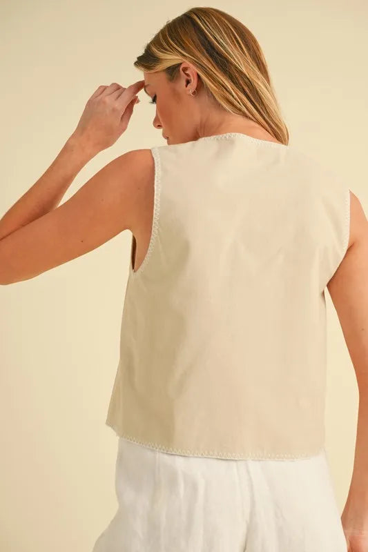 Back of oat embroidered vest with roomy sleeveless cut