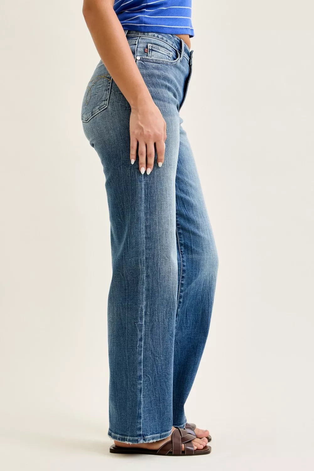 Mid-rise 90s straight jeans in medium wash, side/back view with belt loops