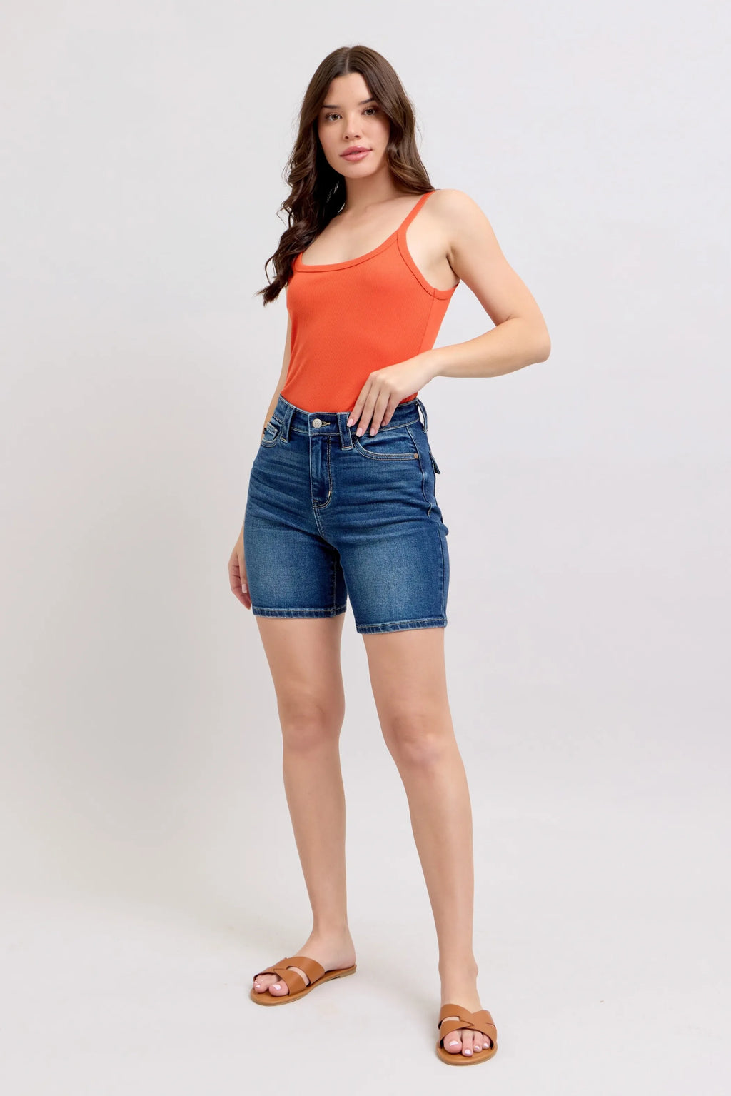 High-waist denim bermuda shorts in blue wash with front pockets and belt loops
