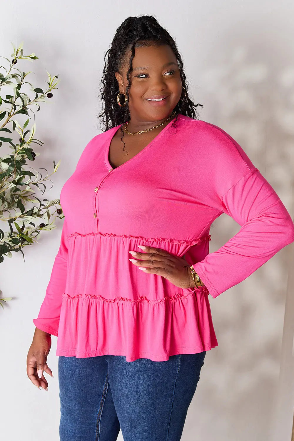 Hot pink tiered ruffle blouse with V-neck half-button front, long sleeves