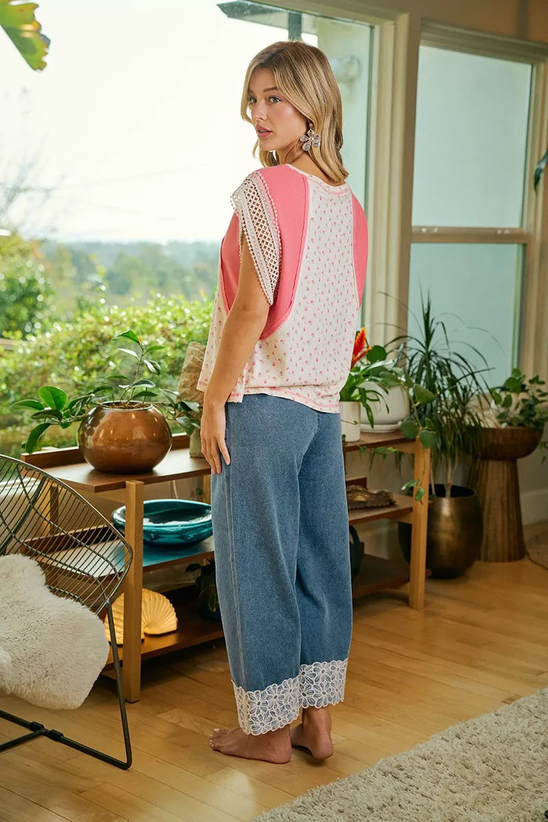 Washed denim pants with elastic drawstring waist and flower lace trim at the leg openings