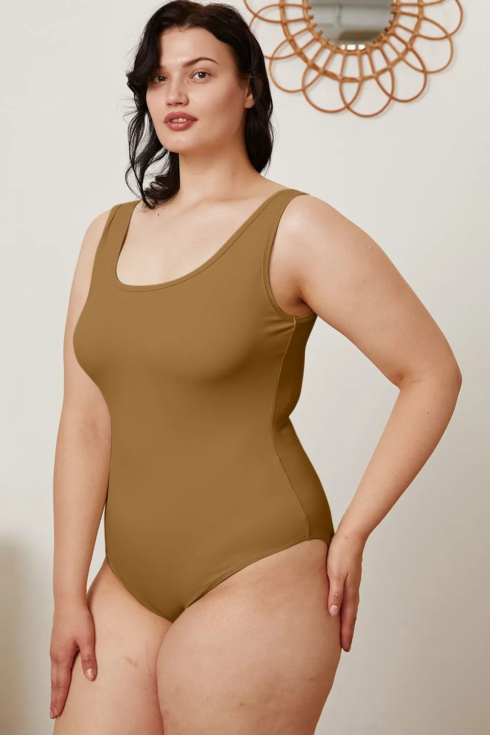 Camel square-neck sleeveless bodysuit, side view with high-cut leg openings