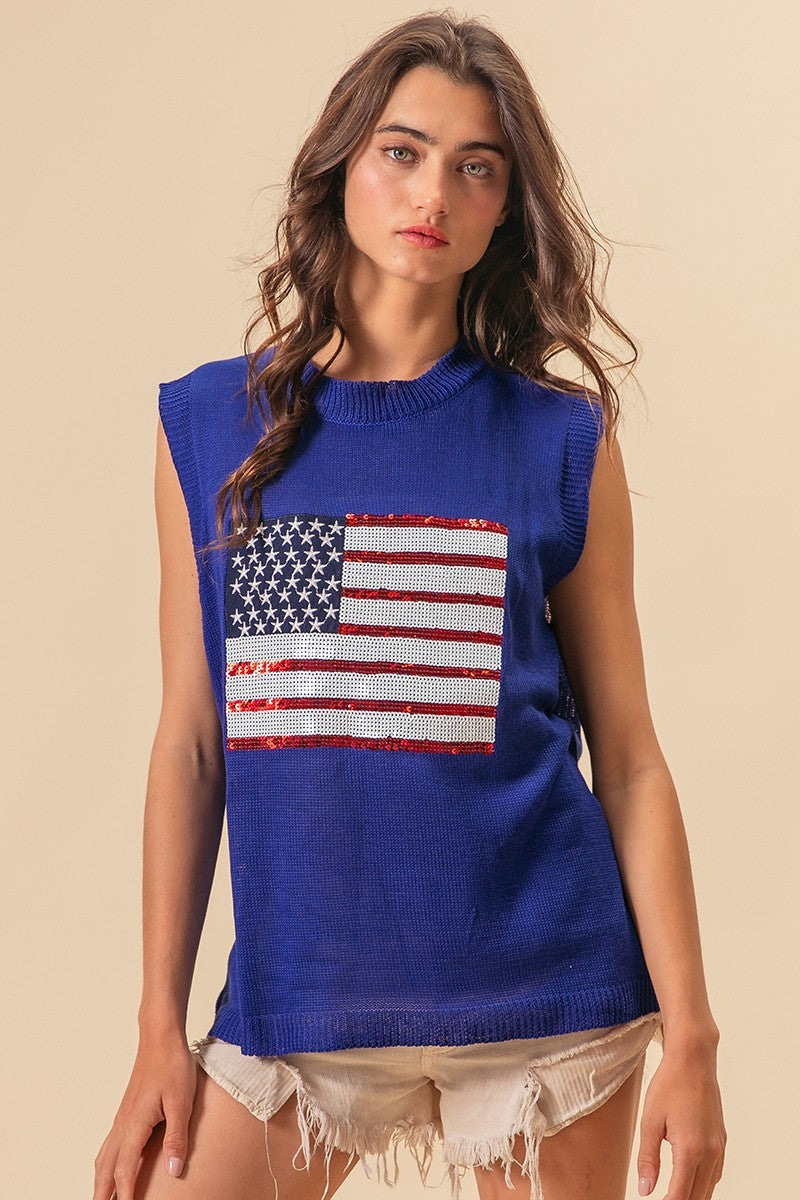 Royal blue sleeveless knit vest with sequin American flag patch and ribbed hem